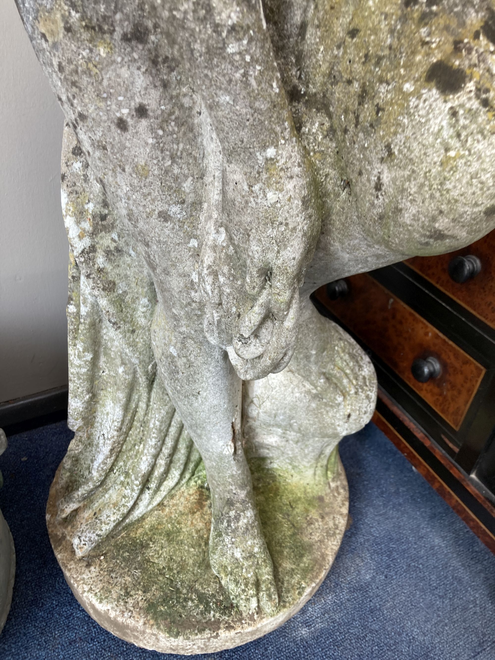 A reconstituted stone garden ornament of a female bather, height 107cm